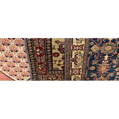 423 - Three various Persian rugs, the largest with floral medallion design on blue ground within a buff bo... 