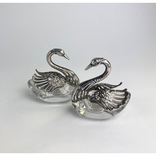 136 - A pair of continental silver and glass swan salts, each marked 835 AB, with articulating wings, reve... 