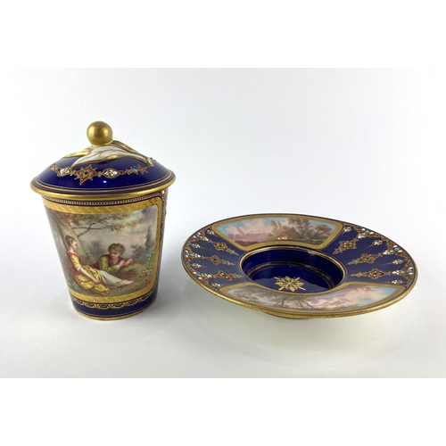 A Sevres porcelain chocolate cup, cover and trembleuse saucer decorated ...