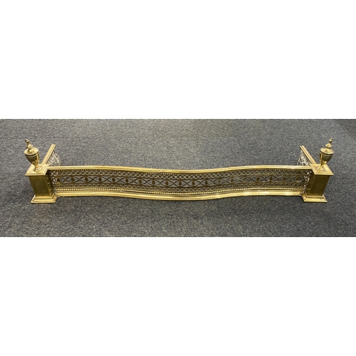 877 - A good 19th century brass fender, of neo classical form, serpentine fronted, pierced decoration and ... 