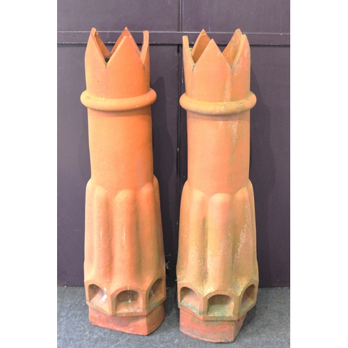 878 - A pair of tall chimney pots with crown tops and base vents,118cm high.... 