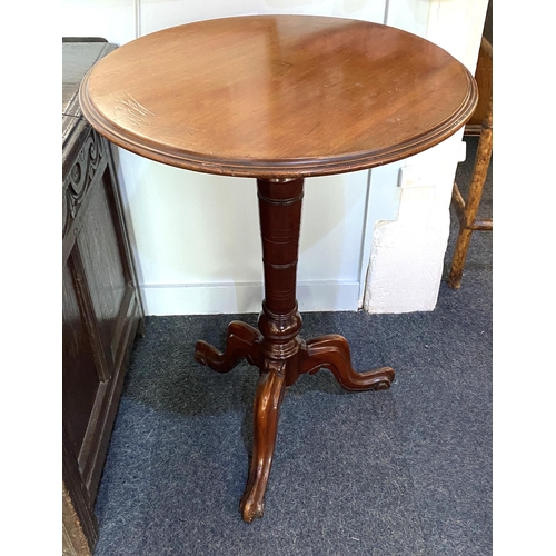 889 - A 19th century mahogany tripod side table, the circular top with moulded edges, raised on a turned c... 