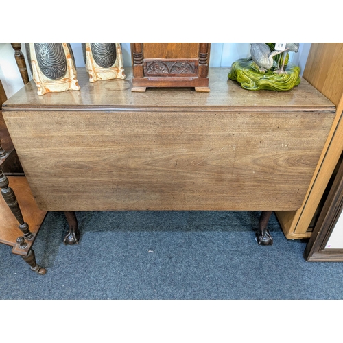 890 - An 18th century mahogany dropleaf cottage dining table, raised on claw and ball supports, 108cm by 4... 