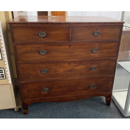 909 - A George III mahogany chest of two short over three long graduated drawers, with gilt-brass oval han... 