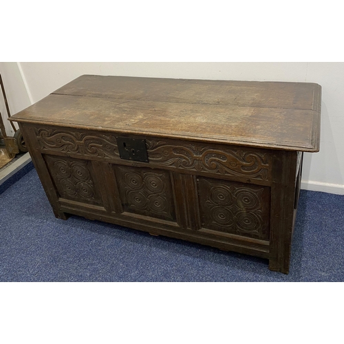 914 - An 18th century and later oak coffer with carved three panel front height 69cm, width 147cm, depth 6... 