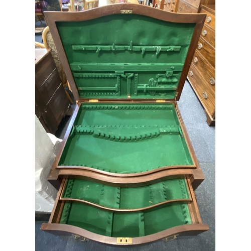918 - An early 20th century Georgian style walnut cutlery table, the serpentine hinged top enclosing a com... 