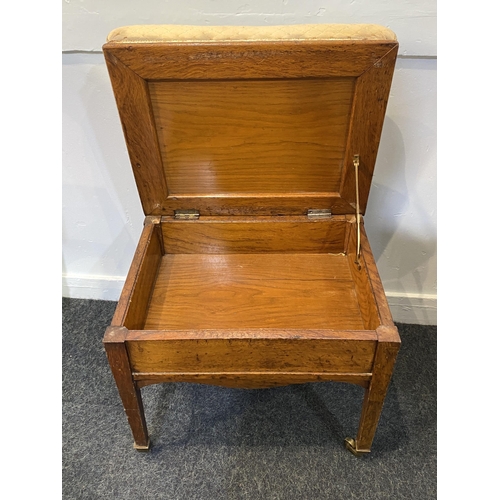 919 - A Victorian piano stool with rising upholstered box seat, on square tapered legs with castors, 50cm... 