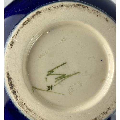 46 - A Moorcroft anemone pattern baluster vase, blue ground, marks to base, 12cm high... 