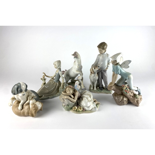 10 - Lladro Porcelain: comprising two fairies, a unicorn, a boy with a dog, and a girl with a bird. Toget... 