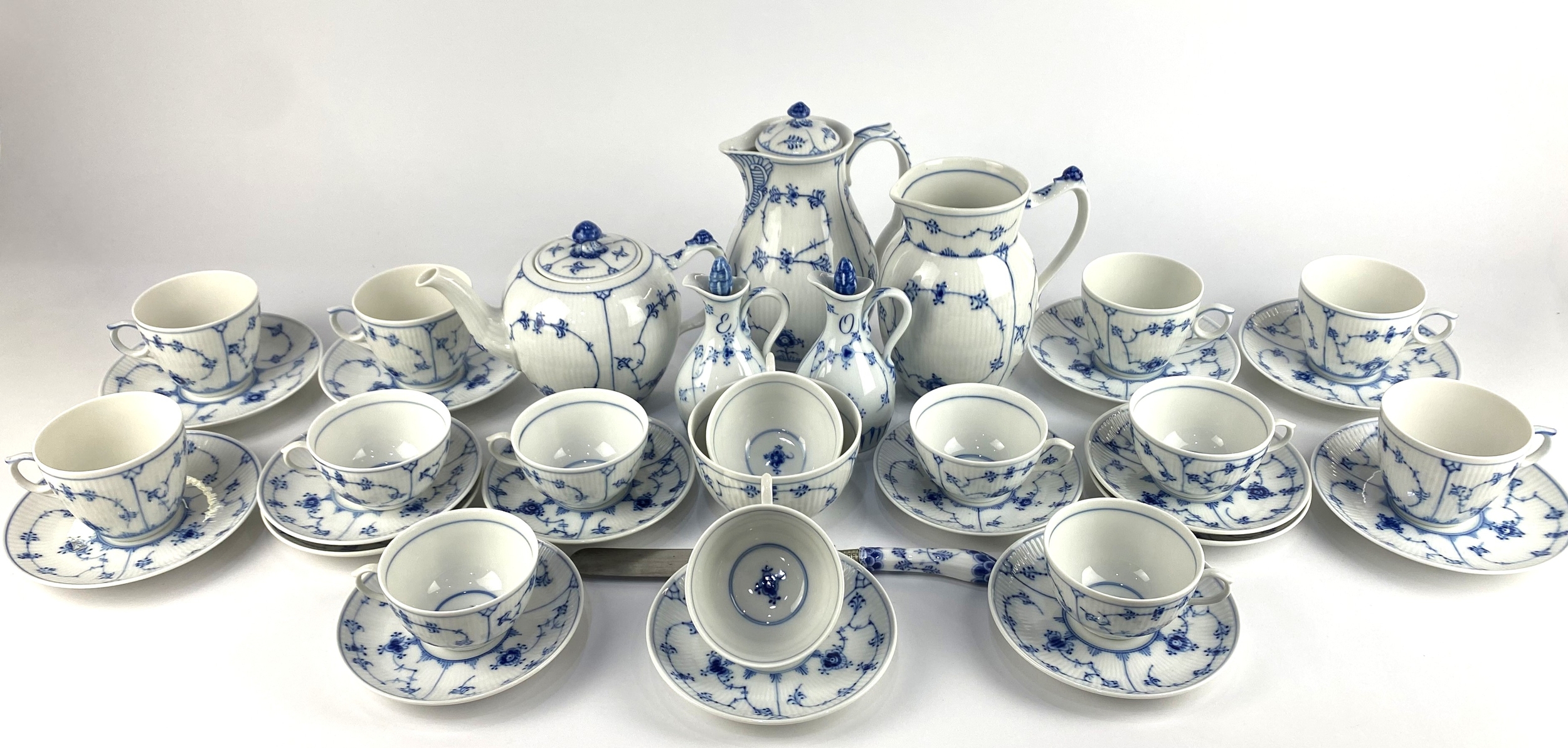 A Royal Copenhagen blue and white fluted porcelain tea set, thirty five ...