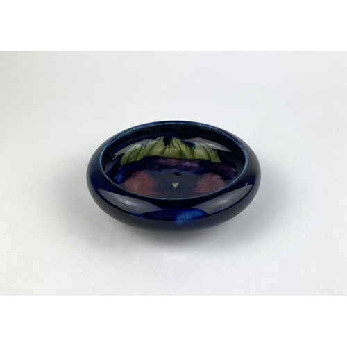 24 - A William Moorcroft 'Pansy' pattern bowl, c.1940's, of shallow lobbed circular form, impressed marks... 