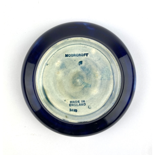 24 - A William Moorcroft 'Pansy' pattern bowl, c.1940's, of shallow lobbed circular form, impressed marks... 