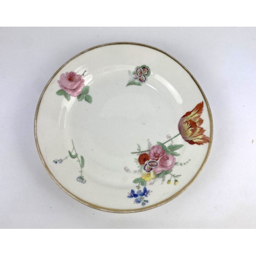 26 - An early 19th century glassy paste porcelain plate painted with flowers, believed Swansea Trident (n... 