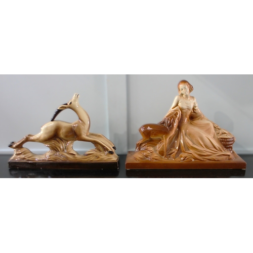 28 - Two Art Deco ceramic figures, probably French, modelled as a leaping Gazelle on naturalistic base, 5... 