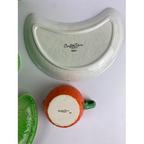 35 - A Carlton ware ceramic salad bowl, four kidney shaped salad plates and a small orange jug (a/f)... 