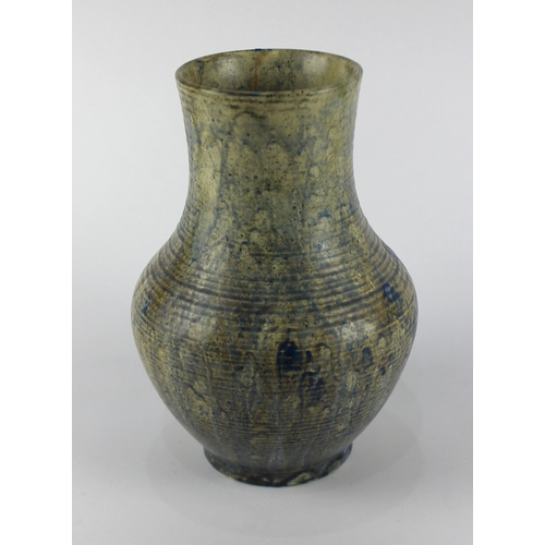 42 -  A Moorcroft art pottery vase, the bulbous ribbed form in an all over drip glaze to both the outside... 