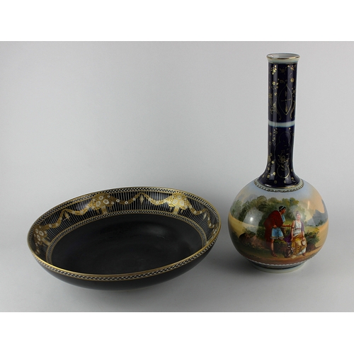53 - A large Royal Worcester porcelain bowl of ogee sided circular shape, with wide gilt, black and white... 