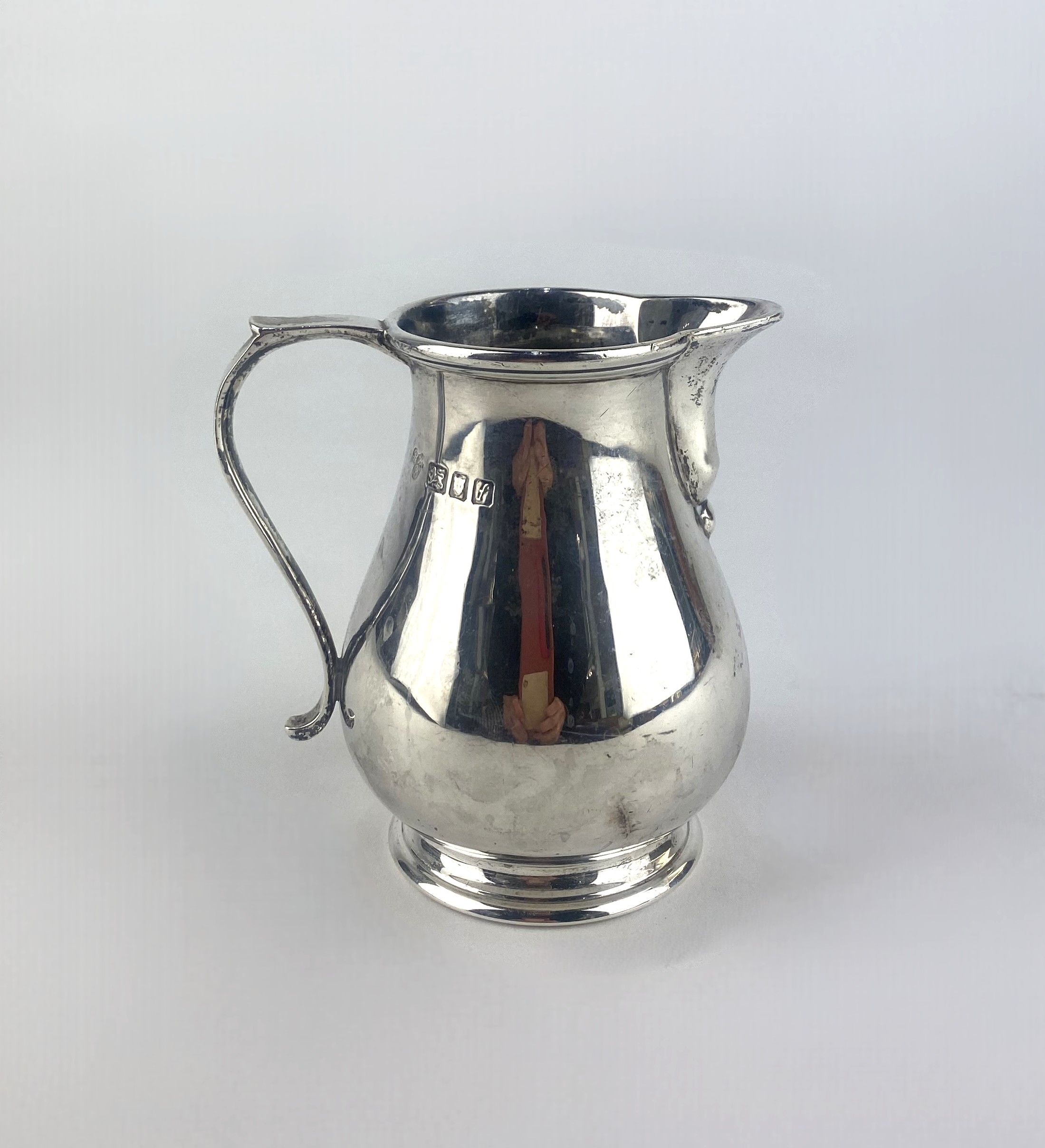 An Elizabeth II silver milk jug, by Harrods (RWB), London, 1961, on ...