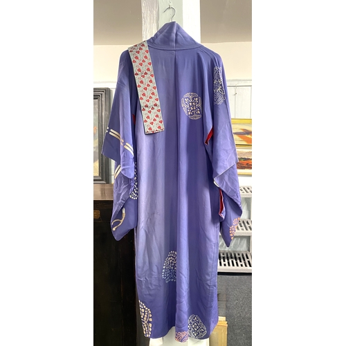 103 - A Japanese purple patterned kimono lined in red silk, with associated belt