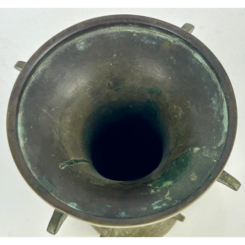 104 - A Chinese bronze Gu vase, with incised decoration depicting a deer, birds, and naturalistic designs,... 