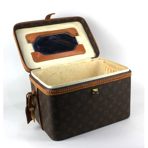 108 - A Louis Vuitton vanity case with leather trim and strap case 22cm high by 32cm wide by 21.5cm deep... 