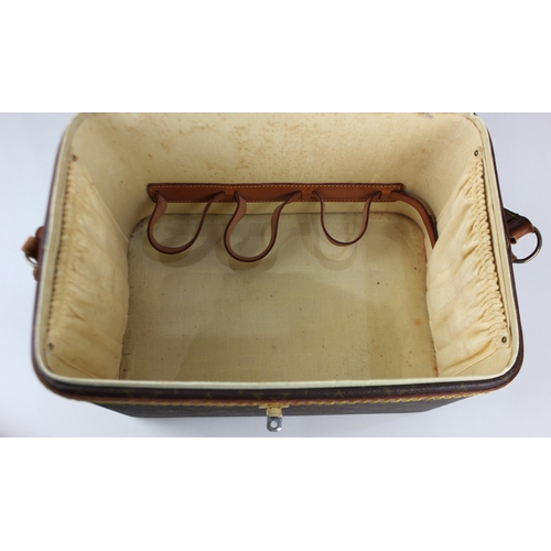 108 - A Louis Vuitton vanity case with leather trim and strap case 22cm high by 32cm wide by 21.5cm deep... 