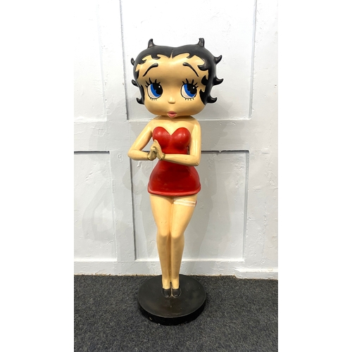 125 - A painted resin figure of Betty Boop 88cm high (a/f - repair)