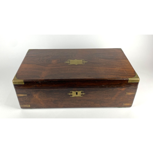130 - A Victorian rosewood and brass bound writing slope with vacant cartouche, the interior with green le... 