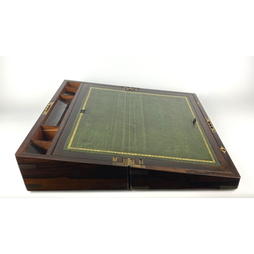 130 - A Victorian rosewood and brass bound writing slope with vacant cartouche, the interior with green le... 