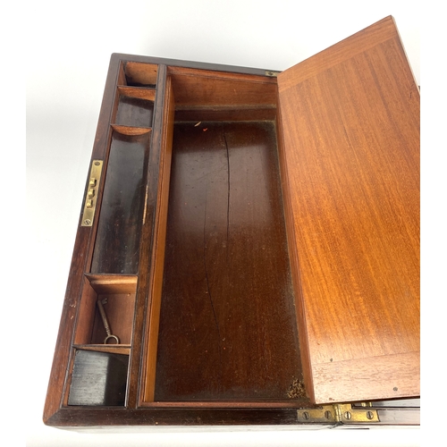 130 - A Victorian rosewood and brass bound writing slope with vacant cartouche, the interior with green le... 