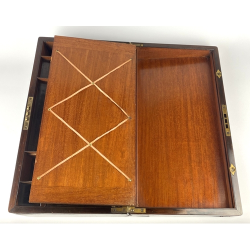 130 - A Victorian rosewood and brass bound writing slope with vacant cartouche, the interior with green le... 