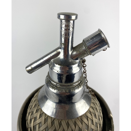 134 - A vintage Sparklets wire-mesh-bound glass soda syphon 37cm high