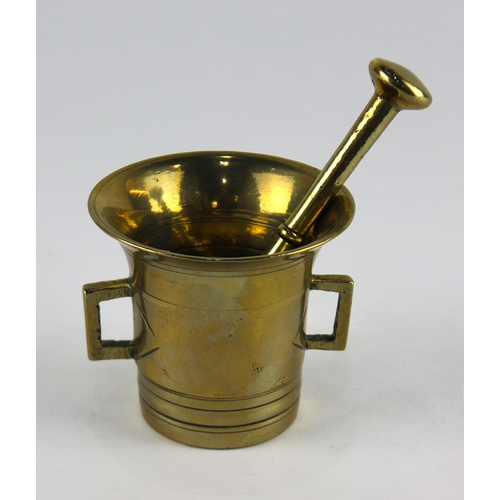 138 - A heavy gilt brass pestle and mortar, mortar 9cm high