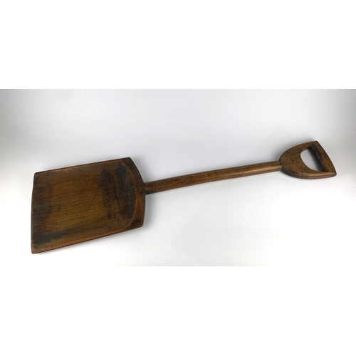 147 - An antique carved wood brewer's malt shovel 91cm long