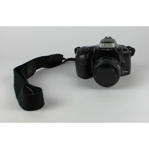 166 - A Minolta Dynax 300si camera with a zoom xi AF 35-200 lens 0.5-1m/1.6-3.3ft, a zoom AF 35-70 0.5m/1.... 