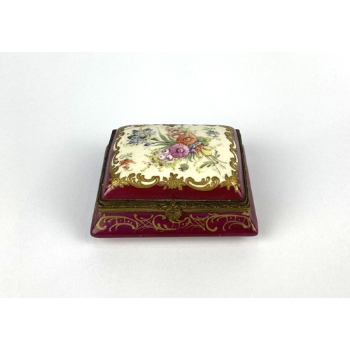21 - A 19th century continental porcelain trinket box, of canted rectangular form, decorated against the ... 