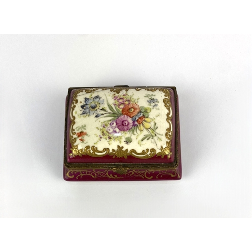 21 - A 19th century continental porcelain trinket box, of canted rectangular form, decorated against the ... 