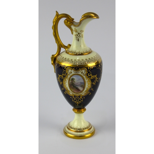 22 - A Coalport porcelain miniature ewer, decorated against the ivory and cobalt blue ground with gilt, c... 