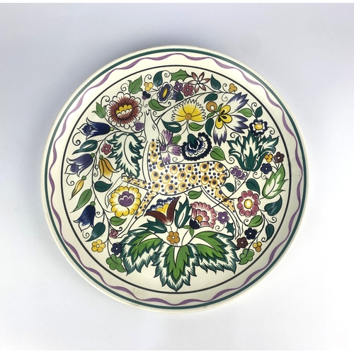 24 - A Pool Pottery charger hand painted by Gwen Haskins in the 'Persian Deer' pattern, 34cm diameter.... 