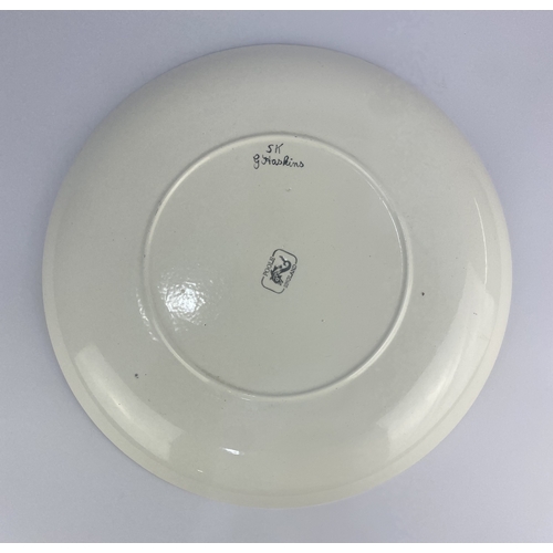 24 - A Pool Pottery charger hand painted by Gwen Haskins in the 'Persian Deer' pattern, 34cm diameter.... 