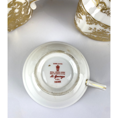 42 - A Royal Crown Derby 'Gold Aves' pattern teapot and milk jug, numbered A.1235, each gilt decorated wi... 