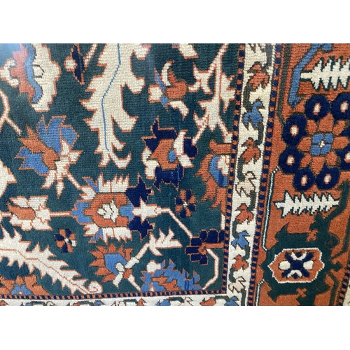 457 - A good quality Persian Heriz rug, 285cm by 195cm.... 