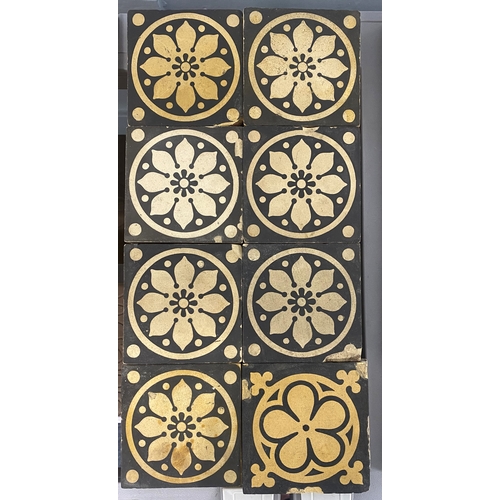 46 - Thirteen encaustic tiles with a buff flower within a circle on black background, 10.7cm by 10.7cm, a... 