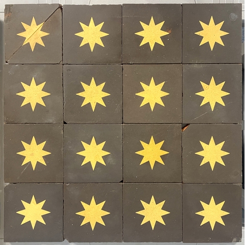 49 - Sixteen Maw & Co encaustic tiles (one divided in half) decorated with buff star on dark brown-/b... 