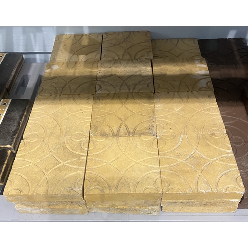 56 - Thirty-five buff coloured tiles with inset grooved design of flowers within circles, 13cm by 13cm... 