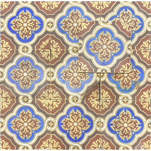 57 - Nineteen Minton & Co tiles with repeating design in buff, red, brown, blue and white, 15.2cm by ... 