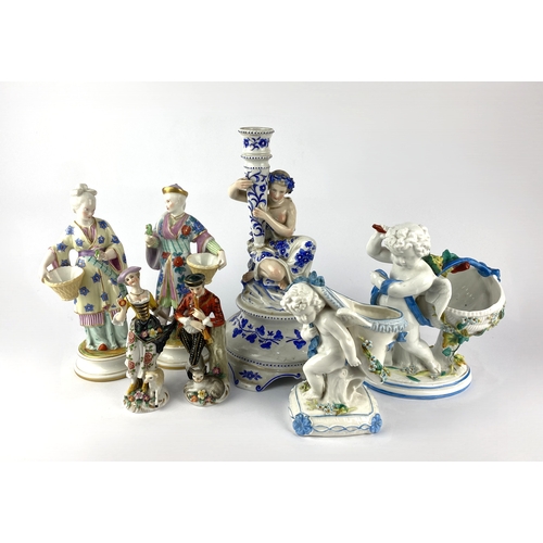489 - A pair of 19th century continental porcelain figures depicting a male and female in floral decorated... 