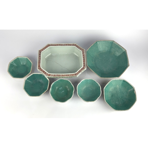 109 - A Chinese porcelain planter, decorated with panels of figures within an interior, of octagonal form,... 