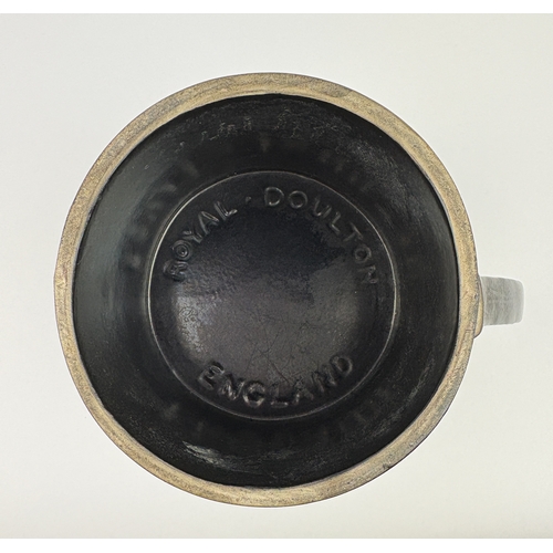 27 - A Royal Doulton ceramic novelty 'leatherware blackjack' tankard, 14.5cm high.... 