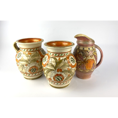 72 - Charlotte Rhead: a tube lined single handled vase for Crown Ducal, signed, 21cm high, a similar vase... 